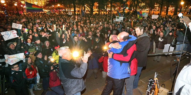 Dec. 23, 2013: Dan Trujillo, left, and Clyde Peck get married as about 1,500 people gather to show support of marriage equality at Washington Square, just outside of the Salt Lake City and County Building in Salt Lake City.
