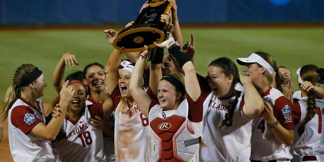 The Oklahoma team celebrates after defeating Florida in the second game of the best-of-three championship series in the NCAA Women's College World Series in Oklahoma City, Tuesday, June 6, 2017. Oklahoma won the game 5-4, and the championship. (AP Photo/Sue Ogrocki)