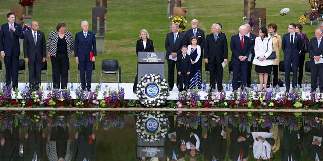 April 19, 2015: Speakers, including former President Bill Clinton, fourth from left, stand at the opening of ceremonies to commemorate the 20th anniversary of the Oklahoma City bombing, at the Oklahoma City National Memorial, in Oklahoma City.