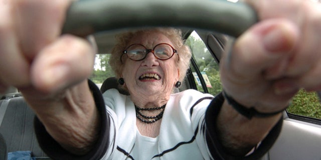 BC-WV--BC-PRI--Older Drivers--Eighty-seven-year-old Dorothy Wulfers, who learned to drive a Model T Ford at age 15, prepares to pull out of her parking space Friday, June 4, 2004 in Morgantown, WV. Wulfers said only her and God will decide when she stops driving. (AP PHOTO/DALE SPARKS)