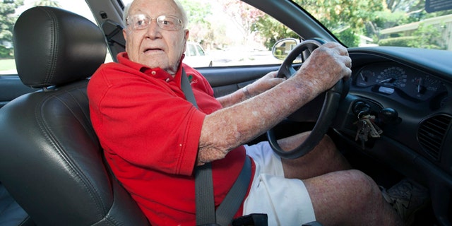 Jack Wyrad, 92, reverses his GM Buick in Los Angeles Thursday, Aug. 30, 2012. Wyard, who got a perfect score on his written test for his license two years ago, says he believes older people should make their own decisions on when to quit driving. On Thursday another licensed Los Angeles driver, 100 years old, accidentally backed his Cadillac into a group of schoolchildren, injuring 11 people. The accident has renewed a debate over when elderly people should quit driving. (AP Photo/Damian Dovarganes)