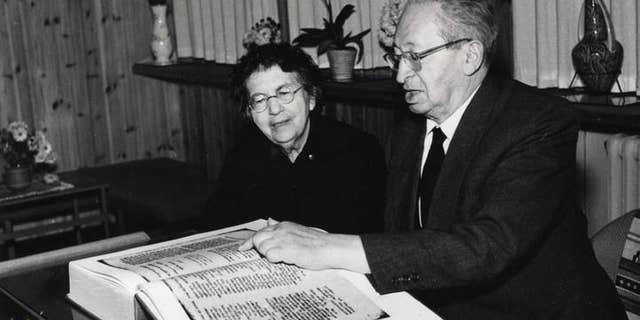 The late president of Israel, Izhak Ben-Zvi, and his wife, Rachel Yanait Ben Zvi, examining a facsimile copy of the Aleppo Codex. (UNESCO)