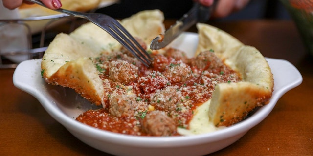 The savory entree clocks in at one pound of Italian cheese, heart meat sauce and up to seven inches of crispy crust.