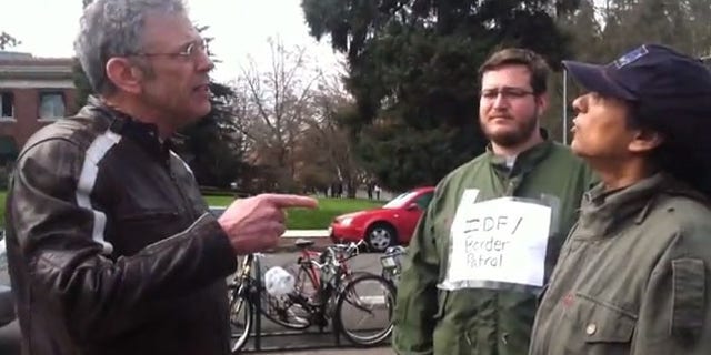 Adjunct Law Professor James Olmstead (left) was fired from the University after a heated exchange with student protesters