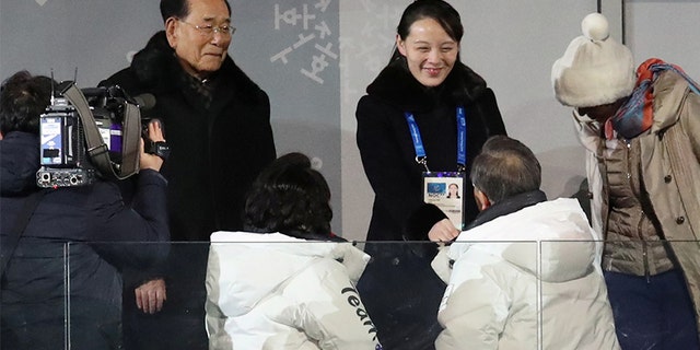 South Korean President Moon Jae-in shakes hands with Kim Jong Un's younger sister, Kim Yo Jong, at the Winter Olympics.