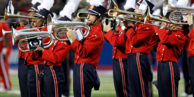 In this Oct. 17, 2009 photo taken before the NCAA college football game in Oxford, Miss., the University of Mississippi band, "The Pride of the South," play the national anthem in Oxford, Miss.