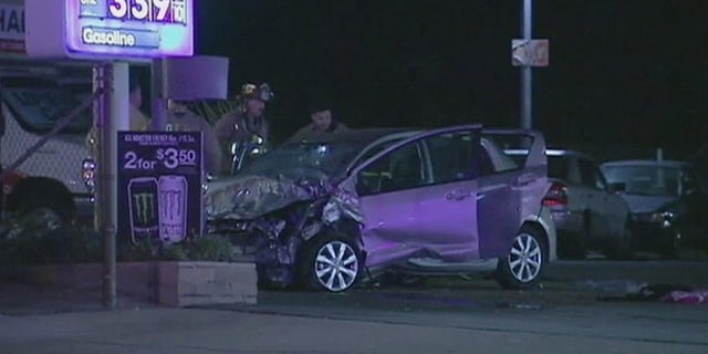 Photo shows car that coroner's office says accelerated uncontrollably and veered off freeway in Ontario, Calif., on New Year's Eve, killing five people. (Fox 11)