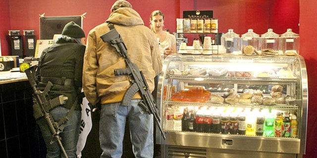 December 7, 2013: Stephanie McDonald and James Franklin buy coffee while participating in an open carry demonstration in Texas (AP).