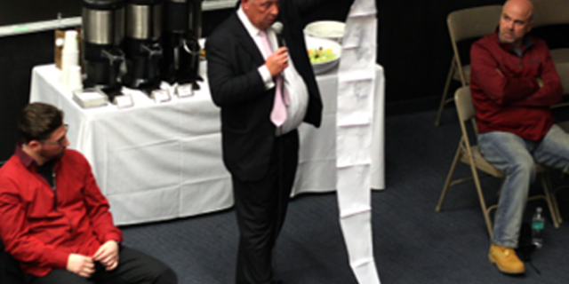 Kevin Moran, a funeral director on Staten Island, shows students a list of death certificates of young people whose bodies have been brought into his funeral home.