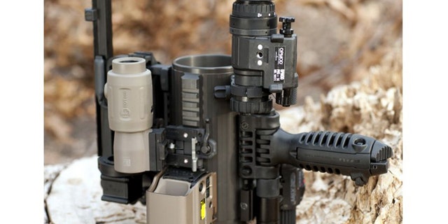 Underneath all the scopes and sights and handles sits a 24-ounce mug perfect for a hot coffee or a cold beer.