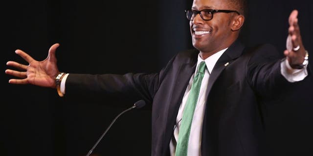 New University of Oregon NCAA college football coach Willie Taggart jokes with the audience during an introductory press conference in Eugene, Ore., Thursday Dec. 8, 2016. (Chris Pietsch/The Register-Guard via AP)