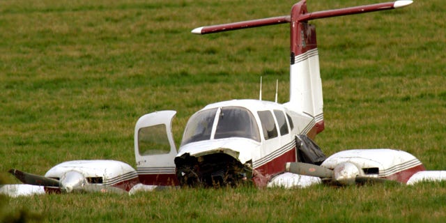 Oct. 26, 2011: A Beechcraft V35 plane sits in the field where it made an emergency landing late Tuesday after colliding with another plane in Wilsonville, Ore.