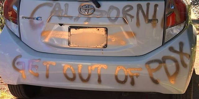 A California couple turned Portlanders said their home and car were spray-painted hours after a road rage incident.