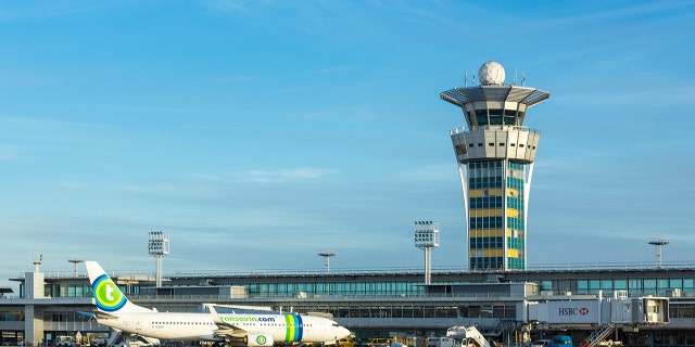 The artists were both traveling to Barcelona for concerts and allegedly – and unexpectedly – crossed paths at Orly.