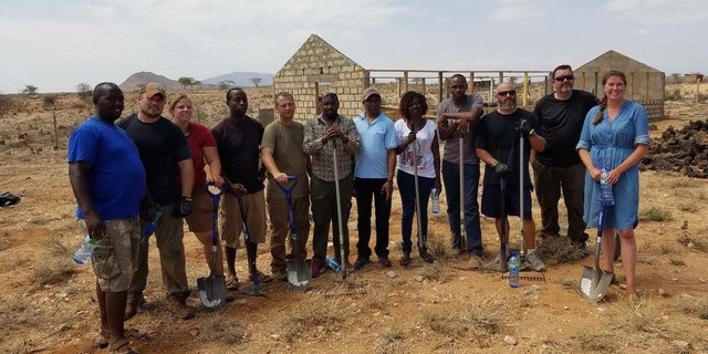 Workers and volunteers building the new home for the Kenyan kids.