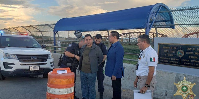 Oscar Lozada brought by Mexican authorities to Border Patrol agents in Eagle Pass, Texas, Thursday.