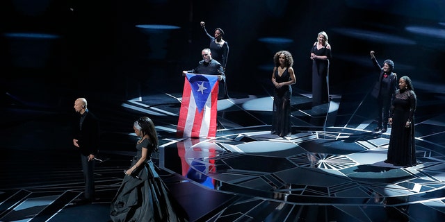 Common and Andra Day performed a song accompanied by activists at the 2018 Oscars.