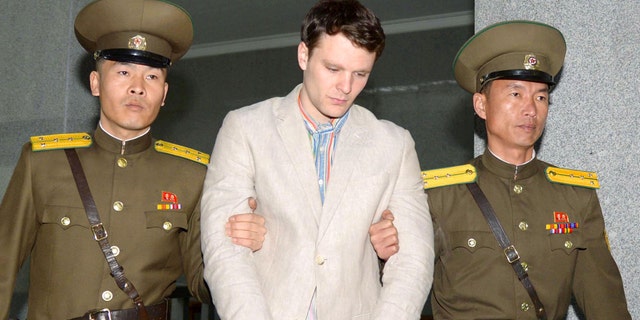 Otto Frederick Warmbier (C), a University of Virginia student who was detained in North Korea, is taken to North Korea's top court in Pyongyang, North Korea, in this photo released by Kyodo March 16, 2016.