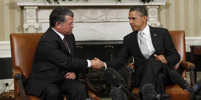 AP image of President Obama and King Abdullah making remarks to the press in the Oval Office.