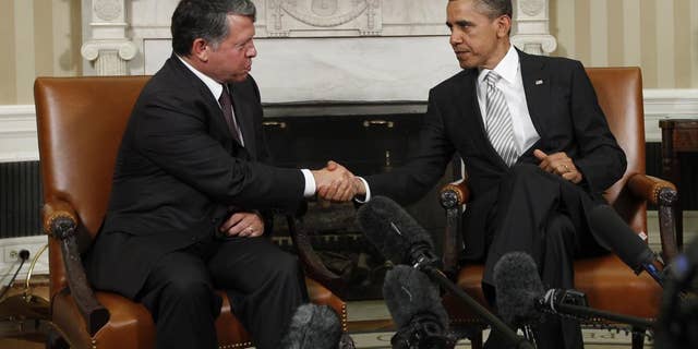 AP image of President Obama and King Abdullah making remarks to the press in the Oval Office.