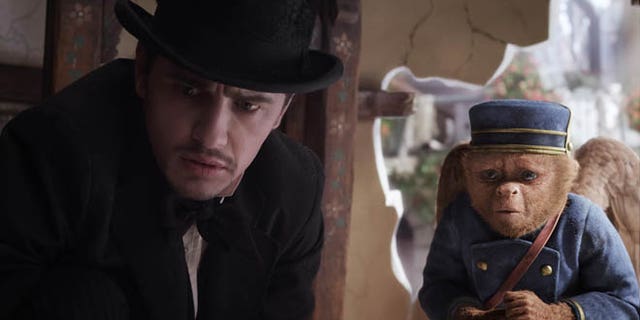 This file film image provided by Disney Enterprises shows James Franco, as Oz, left, and the character Finley, voiced by Zach Braff, in a scene from "Oz the Great and Powerful." Oz the Great and Powerful is living up to its name at the box office. Walt Disney's 3-D blockbuster has led all films for the second week in a row, taking in $42.2 million according to studio estimates.