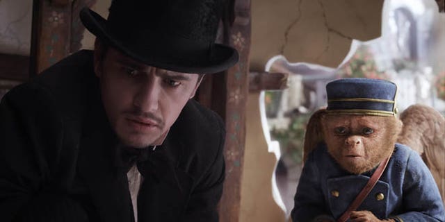 This file film image provided by Disney Enterprises shows James Franco, as Oz, left, and the character Finley, voiced by Zach Braff, in a scene from "Oz the Great and Powerful." Oz the Great and Powerful is living up to its name at the box office. Walt Disney's 3-D blockbuster has led all films for the second week in a row, taking in $42.2 million according to studio estimates.
