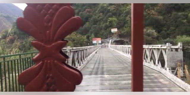 Looking out at the bridge crossing into India from the heavily-contested Pakistan side of the Kashmir