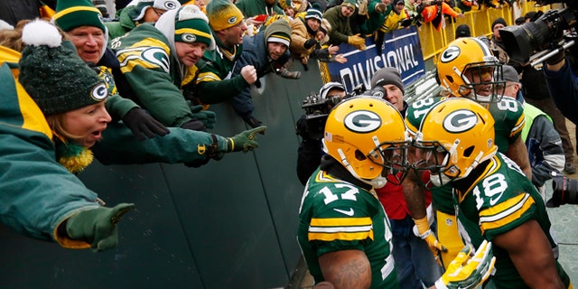 Jan. 11, 2015: Green Bay Packers wide receiver Davante Adams (17) celebrates a touchdown with wide receiver Randall Cobb (18) and tight end Andrew Quarless (81) during the second half of an NFL divisional playoff football game against the Dallas Cowboys in Green Bay, Wis.
