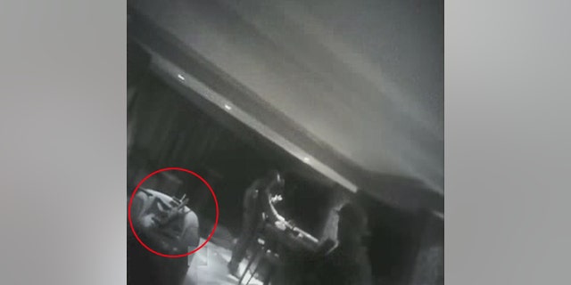 Police body cam footage shows a gun resting on chair. It is unclear if the weapon belonged to Paddock or police.