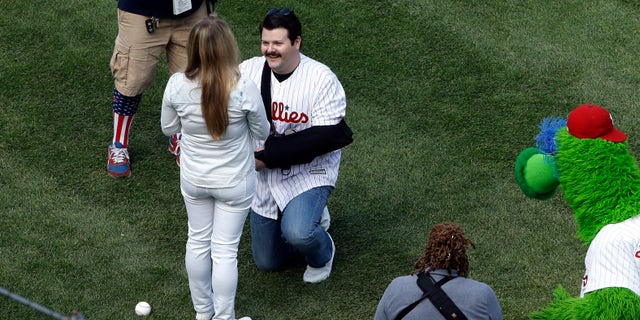 Philadelphia Police Officer Jesse Hartnett proposes to Lily Abdullina before a Phillies game.