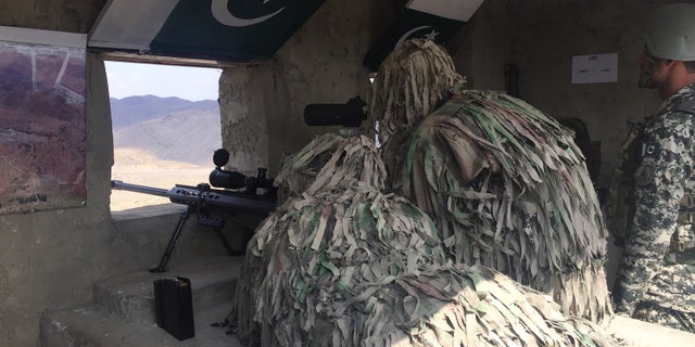 Pakistan soldiers keep watch near the Khyber Pass crossing between Pakistan and Afghanistan