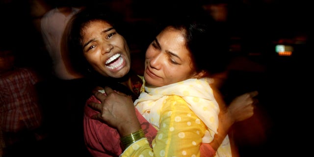 Women mourn the death of a family member who was killed in a bomb blast in Lahore, Pakistan.