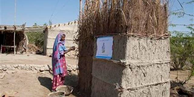 March 3, 2015: In this photo, a Pakistani villager builds a toilet in Thatta district, Sindh province, 62 miles southeast of Karachi, Pakistan.