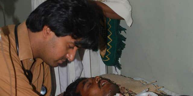 A doctor cares for the man who suffered life-threatening injuries from an acid attack.