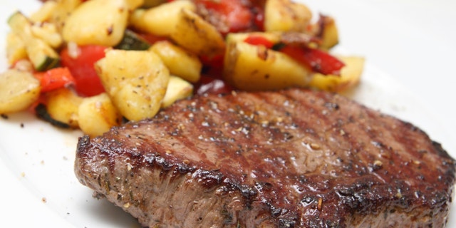 Barbecued beef steak with potaoes and mixed vegetable