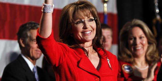 In this May 2, 2011, file photo, former Alaska Governor Sarah Palin waves during a fundraiser at Colorado Christian University in Lakewood, Colo. (AP Photo/Ed Andrieski)