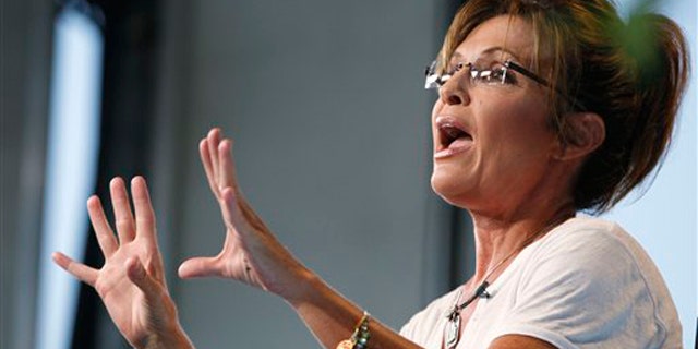 Former Alaska Gov. Sarah Palin speaks as she is interviewed by Fox News at the Iowa State Fair in Des Moines, Iowa, Aug. 12.