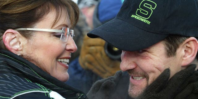 Feb. 14, 2009: Former Alaska Gov. Sarah Palin greets her husband Todd at the finish line of the 2009 Tesoro Iron Dog. (AP)
