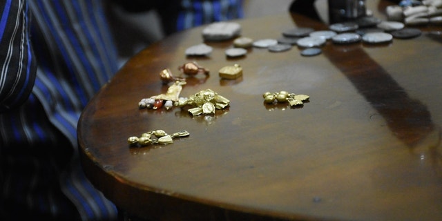 Gold and small coins, presumably stolen from Syria's Palmyra, on the black market in Turkey
