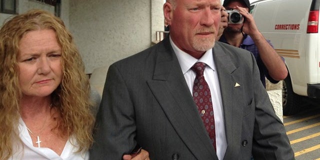 Corrections officer Gene Palmer was sentenced to six months in prison for aiding the escape of two inmates.