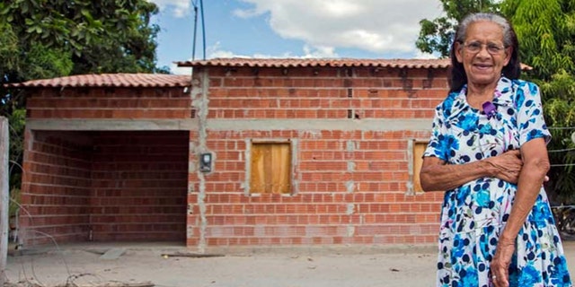 Palmerina Ferreira Lima outside her home in the village of Melancias, Piauí, Brazil.