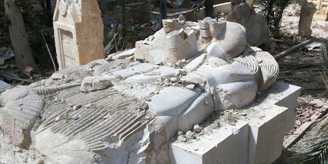 March 27, 2016: A destroyed statue outside the damaged Palmyra Museum, in Palmyra city, central Syria.