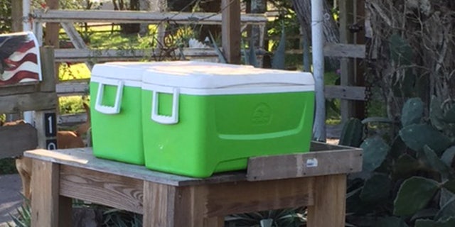 Water coolers outside Pamela Taylor's house.