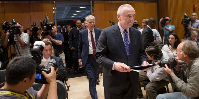 New York City police commissioner William Bratton enter a news conference Wednesday, June 4, 2014.