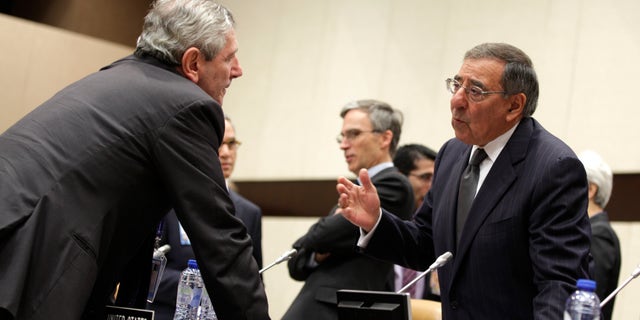 Oct. 10, 2012: Italian Defense Minister Giampaolo Di Paola, left, speaks with United States Secretary of Defense Leon Panetta during a round table meeting of NATO Defense Ministers at NATO headquarters in Brussels.