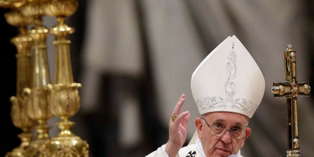 Pope Francis delivers a blessing at the end of a New Year mass in St. Peter's Basilica Jan. 1, 2016.