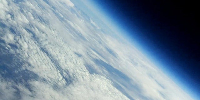 The boundary between Earth and space take center stage in this photo captured by cameras on a balloon-launched paper airplane built by space enthusiasts at The Register in the U.K. The plane was carried to an altitude of about 17 miles before descending back to Earth on Oct. 28, 2010.