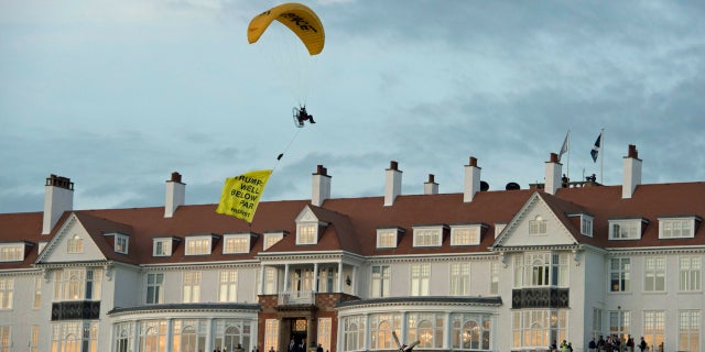 Scottish police are searching for a protester who breached a no-fly zone after paragliding over President Trump’s golf resort.