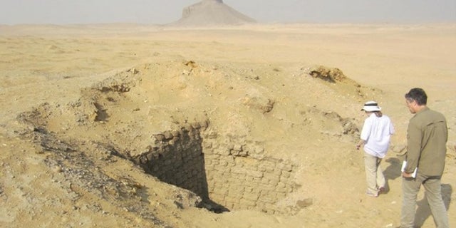 Months after seeing evidence of looting from space, Parcak and her colleagues went to look at the looting pits in Dahshur for themselves. This one was 10 meters (33 feet) deep.