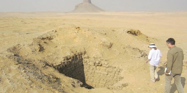 Months after seeing evidence of looting from space, Parcak and her colleagues went to look at the looting pits in Dahshur for themselves. This one was 10 meters (33 feet) deep.